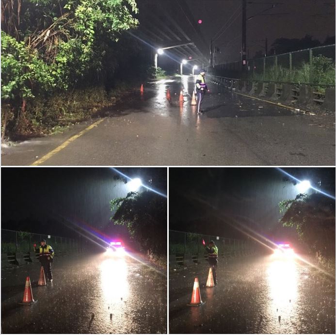 夜來豪雨淹路面，警擺三角錐警示護用路人